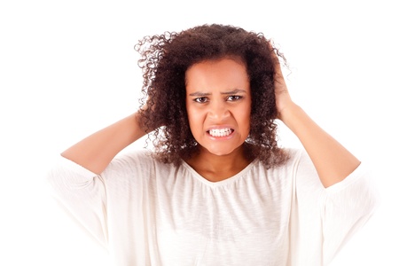 Frustrated and angry african woman over white backgroundの写真素材