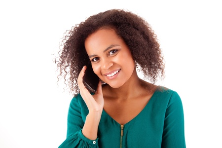 Beautiful african woman on the phoneの写真素材