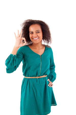 Beautiful afro woman doing ok signの写真素材