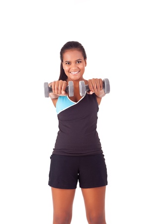 Beautiful african fitness woman working out with free weightsの写真素材