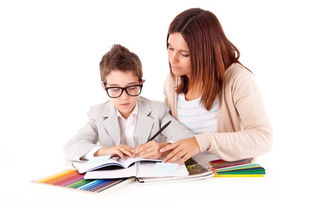 Happy woman, mother or teacher helping kid with schoolworkの写真素材