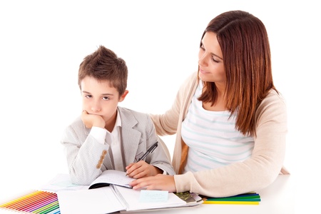 Happy woman, mother or teacher helping kid with schoolworkの写真素材