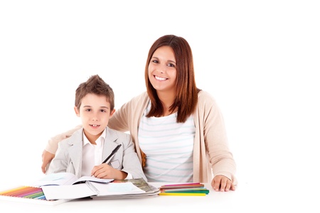 Happy woman, mother or teacher helping kid with schoolworkの写真素材