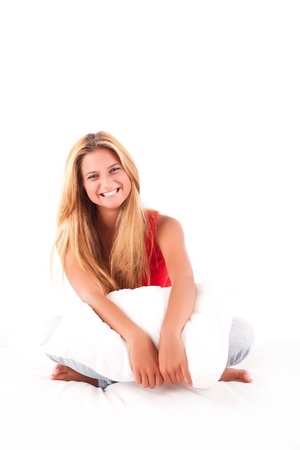 Beautiful blond girl relaxing in bedの写真素材