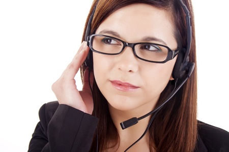 Portrait of a happy young call centre employee smiling with a headset over whiteの写真素材