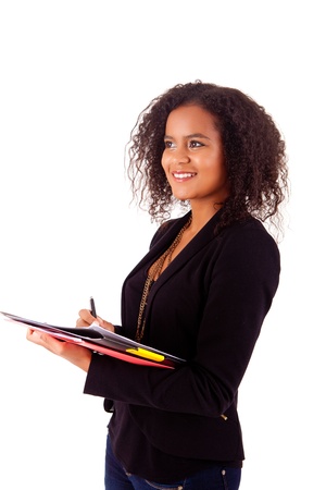 Beautiful african woman scheduling an appointmentの写真素材