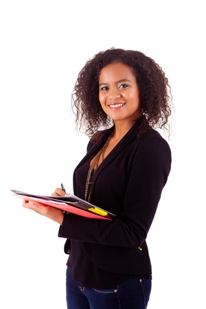 Beautiful african woman scheduling an appointmentの写真素材
