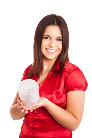 Beautiful woman holding presents while smilingの写真素材