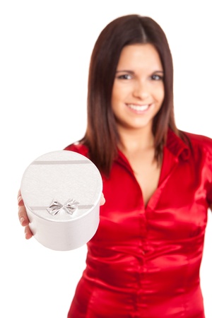 Beautiful woman holding presents while smilingの写真素材