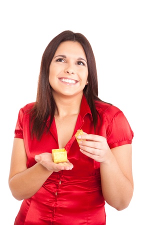 Beautiful woman holding presents while smilingの写真素材