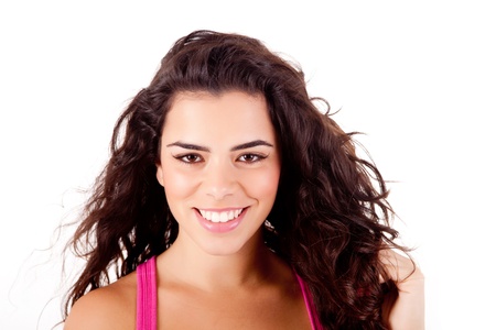 Beautiful woman smiling and posing over white backgroundの写真素材