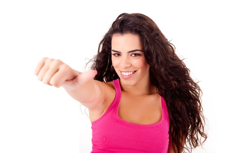 Beautiful woman doing thumbs up over white backgroundの写真素材