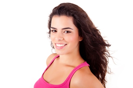 Beautiful woman smiling and posing over white backgroundの写真素材