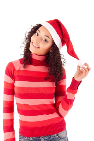 Beautiful african woman celebrating christmas wearing santa hatの写真素材