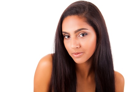 Portrait of a beautiful ethnic woman over white backgroundの写真素材
