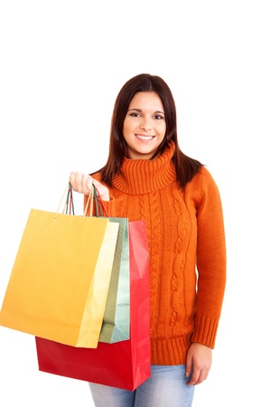 beautiful woman holding shopping bags over white backgroundの写真素材