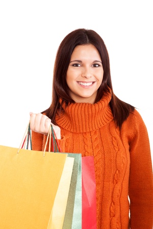 beautiful woman holding shopping bags over white backgroundの写真素材