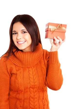 Beautiful woman holding a gift over white backgroundの写真素材