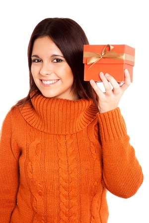 Beautiful woman holding a gift over white backgroundの写真素材