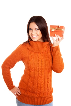 Beautiful woman holding a gift over white backgroundの写真素材