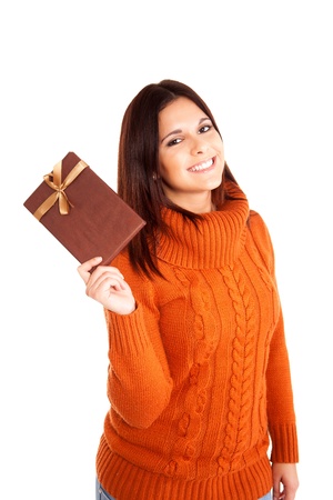 Beautiful woman holding a gift over white backgroundの写真素材