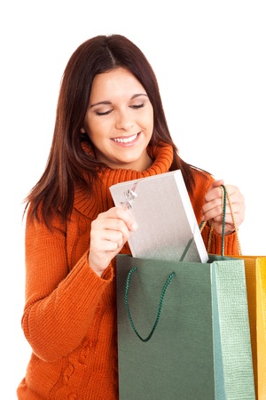beautiful woman holding shopping bags over white backgroundの写真素材
