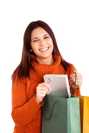 beautiful woman holding shopping bags over white backgroundの写真素材