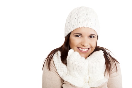 Beautiful woman wearing winter clothes over white backgroundの写真素材