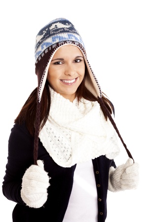 Beautiful woman wearing winter clothes over white backgroundの写真素材