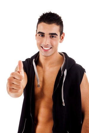Beautiful fitness instructor doing thumbs up over whitebackgoundの写真素材