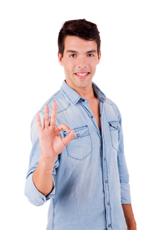 Beautiful man doing ok sign over white backgroundの写真素材