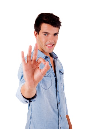 Beautiful man doing ok sign over white backgroundの写真素材