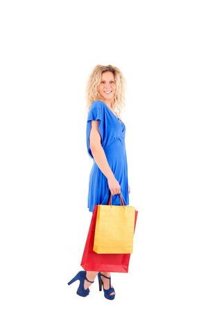 Beautiful blond woman shopping over white backgroundの写真素材