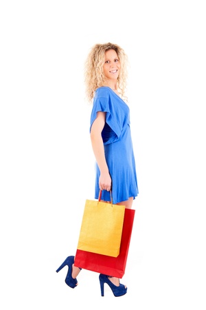Beautiful blond woman shopping over white backgroundの写真素材