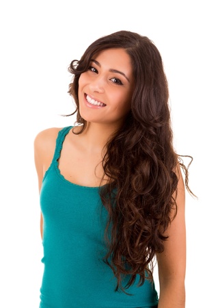 Portrait of a pretty young woman standing against white backgroundの写真素材