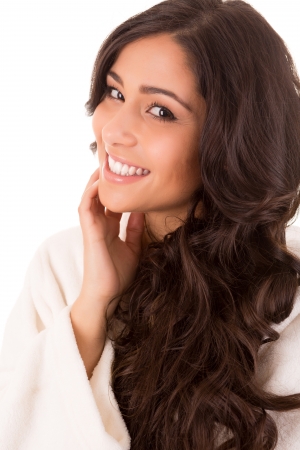 Beautiful woman enjoying with long strong brown hair isolated on white backgroundの写真素材