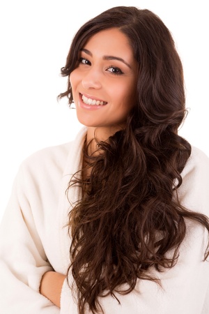 Beautiful woman enjoying with long strong brown hair isolated on white backgroundの写真素材