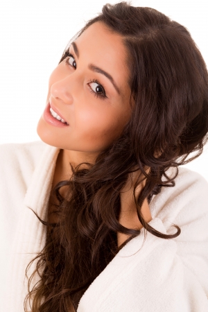 Beautiful woman enjoying with long strong brown hair isolated on white backgroundの写真素材