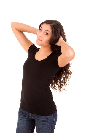 Portrait of a pretty young woman standing against white backgroundの写真素材
