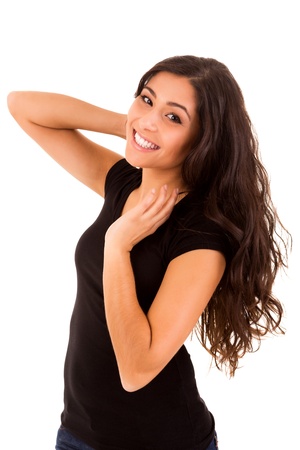 Portrait of a pretty young woman standing against white backgroundの写真素材
