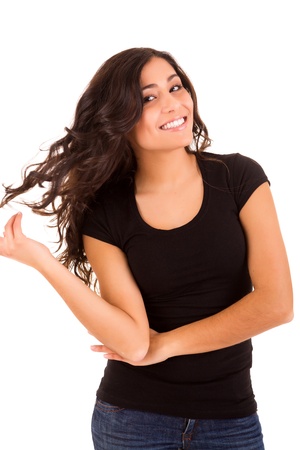 Portrait of a pretty young woman standing against white backgroundの写真素材