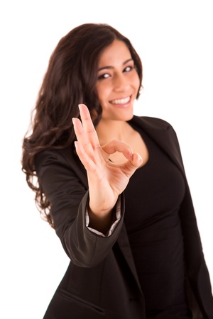 Business woman with an ok sign - selective focus on handの写真素材