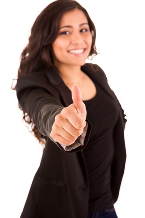 Happy smiling business woman with thumbs up - selective focus on handの写真素材