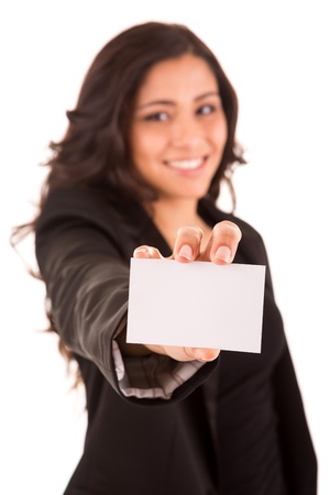 Friendly woman holding a business card and smiling - selective focus on handの写真素材