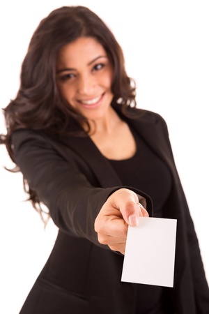 Friendly woman holding a business card and smiling - selective focus on handの写真素材