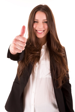 Smiling woman giving thumbs up - selective focus on handの写真素材