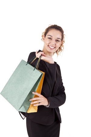 Lovely woman with shopping bags over whiteの写真素材