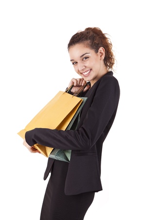 Lovely woman with shopping bags over whiteの写真素材