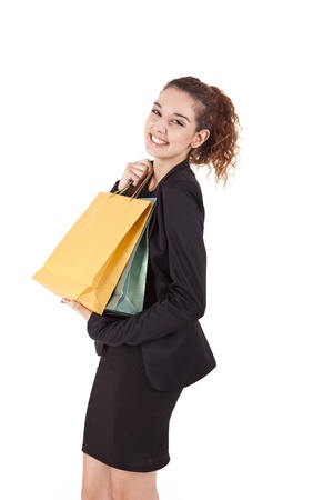 Lovely woman with shopping bags over whiteの写真素材