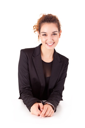 Pretty young business woman smiling on white backgroundの写真素材